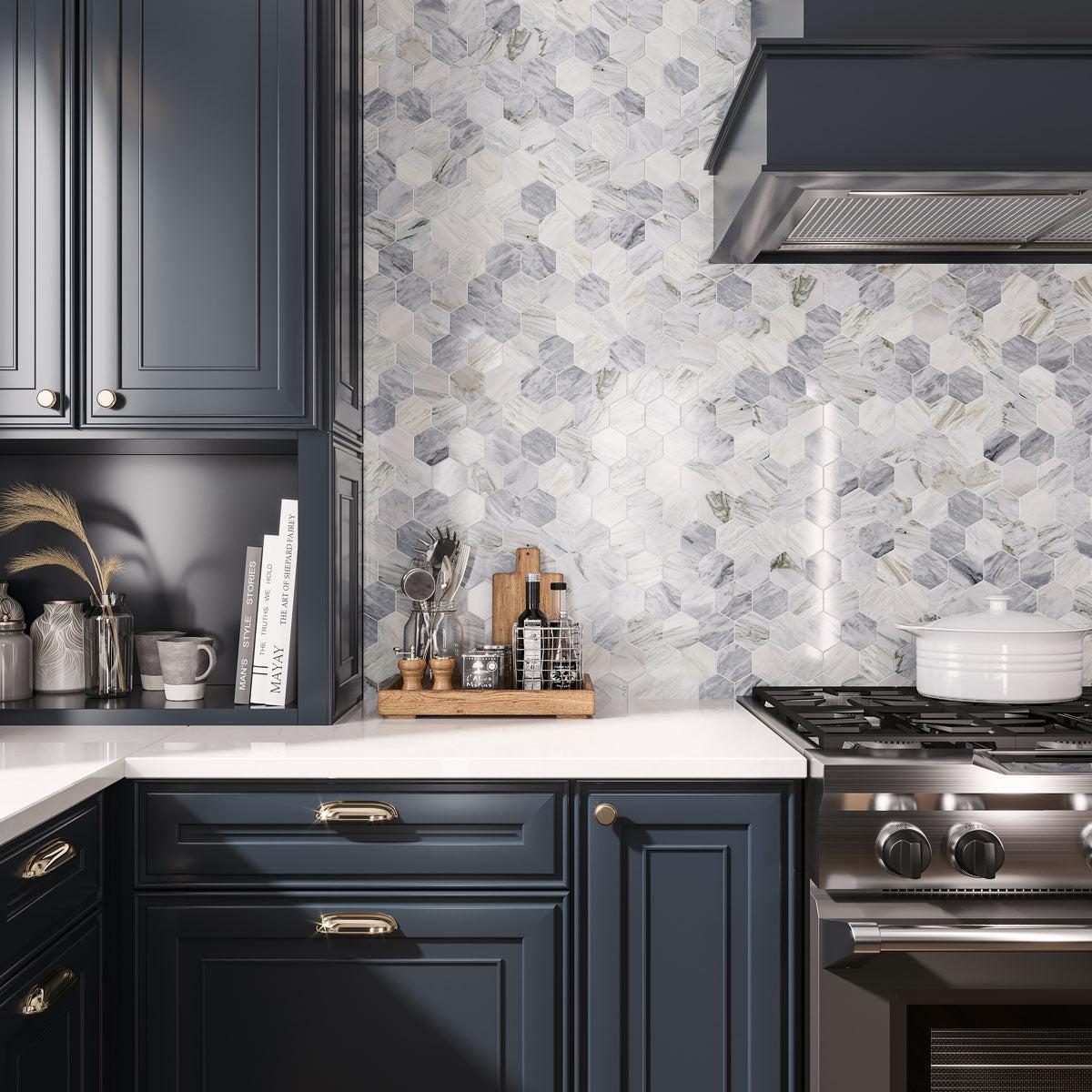 Timeless kitchen design with navy blue cabinet paint and Calacatta Bluette marble hexagon backsplash tile