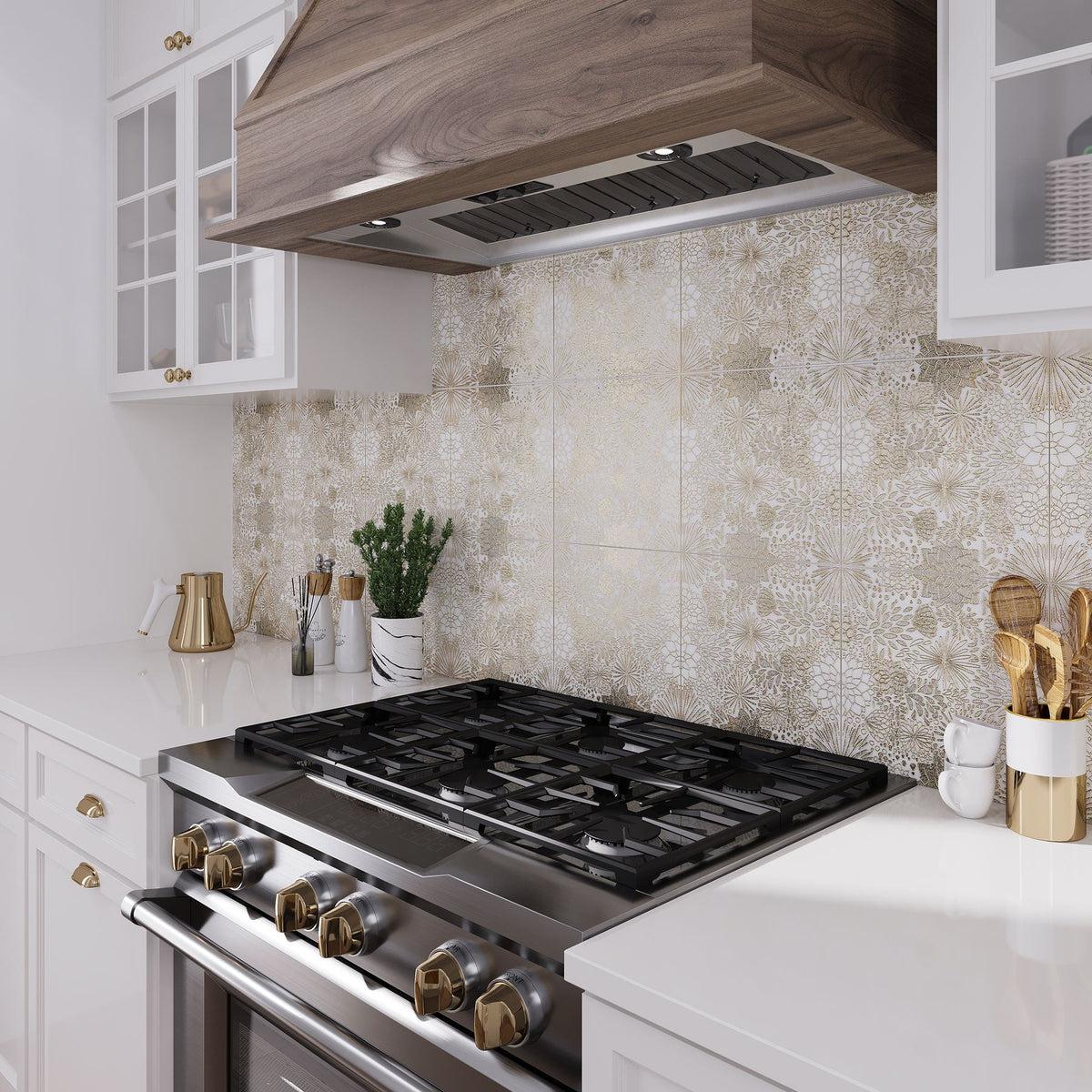 White and gold tile behind kitchen stove with floral pattern