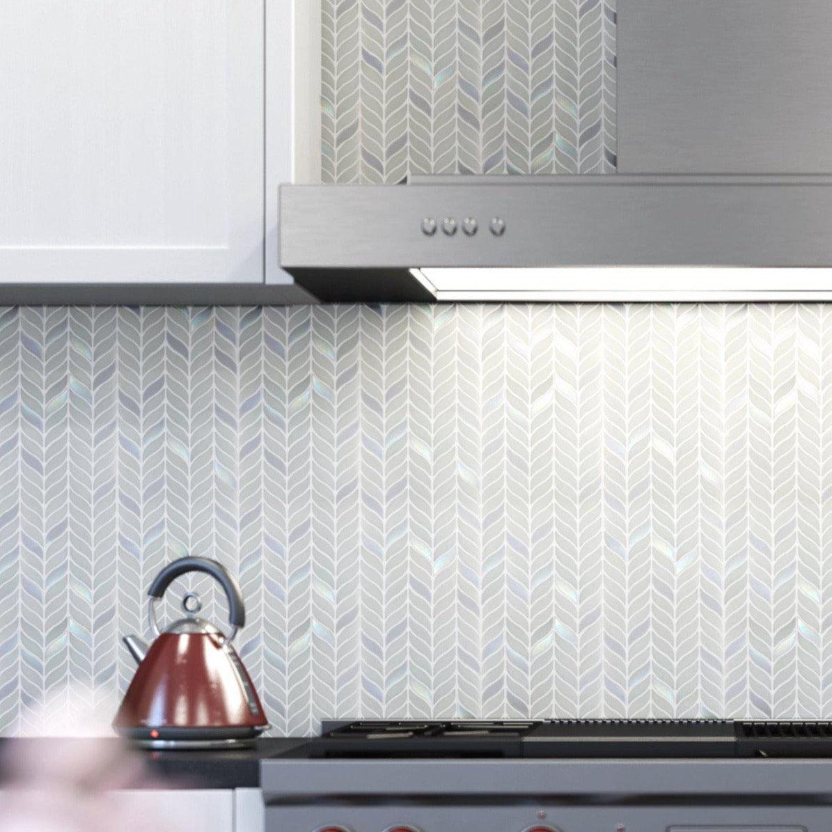 White and gray modern kitchen with white leaf patterned tile backsplash