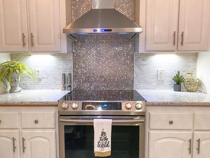 Modern White Kitchen with Marble Brick Backsplash Tile and Metal Penny Rounds