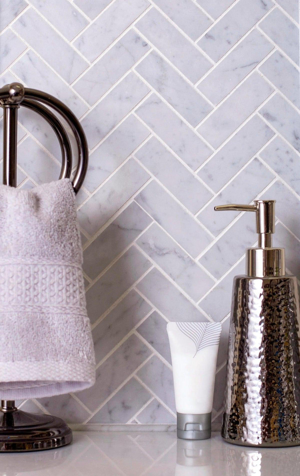 carrara herringbone tile