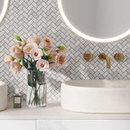 White Carrara Herringbone marble mosaic tile backsplash