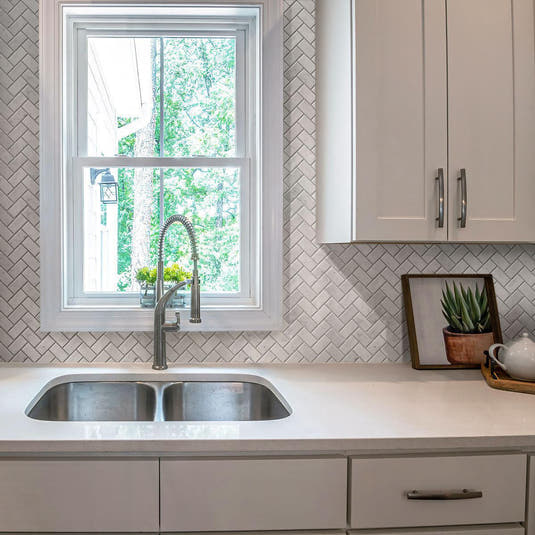 White kitchen with 1X2 White Carrara Herringbone Polished Marble Mosaic Tile backsplash