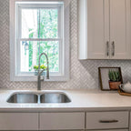 White kitchen with 1X2 White Carrara Herringbone Polished Marble Mosaic Tile backsplash