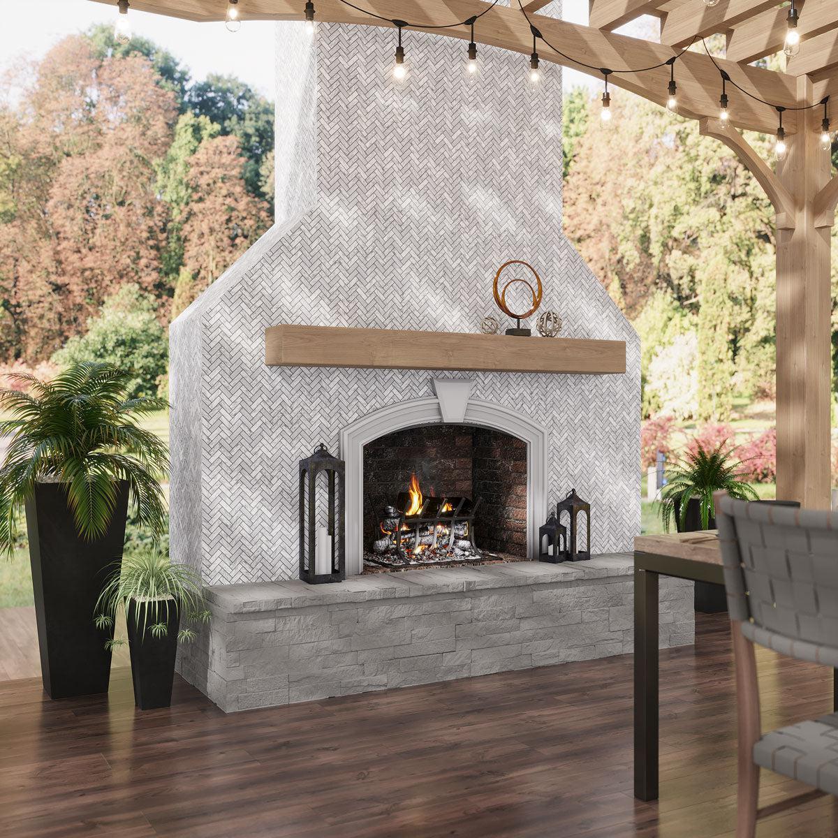 Outdoor patio with marble herringbone tiled fireplace