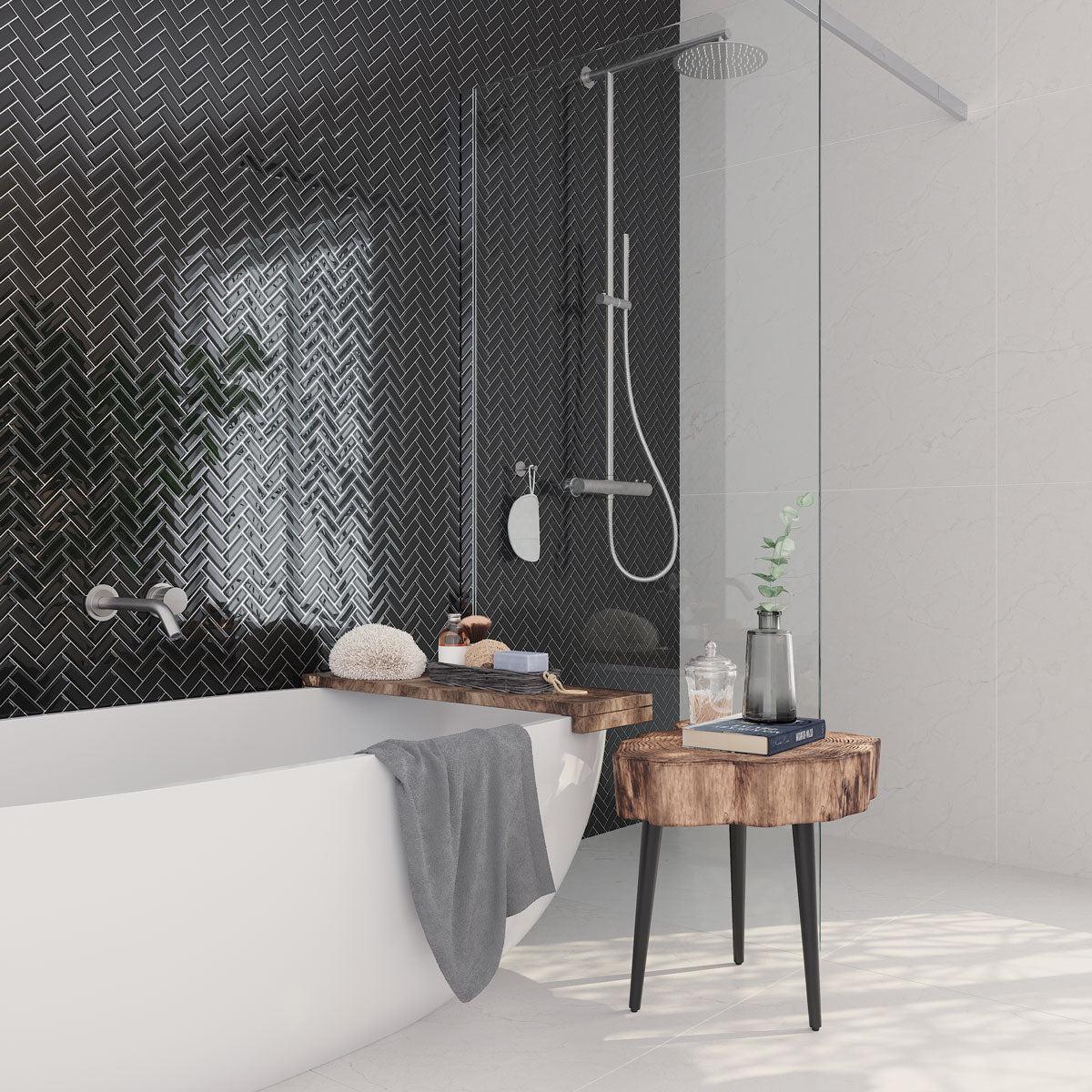 Obsidian Black Glass Herringbone Tile Wall for a Modern Bathroom Tub Surround