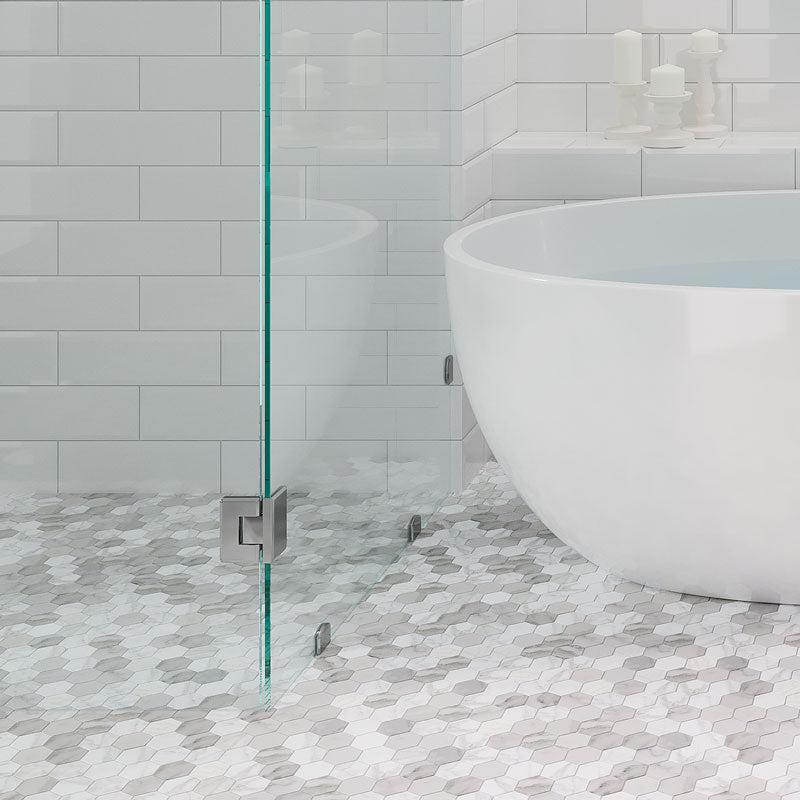 Glass Shower and White Bathtub on the Calacatta Gold Hexagon Tile Polished Floor