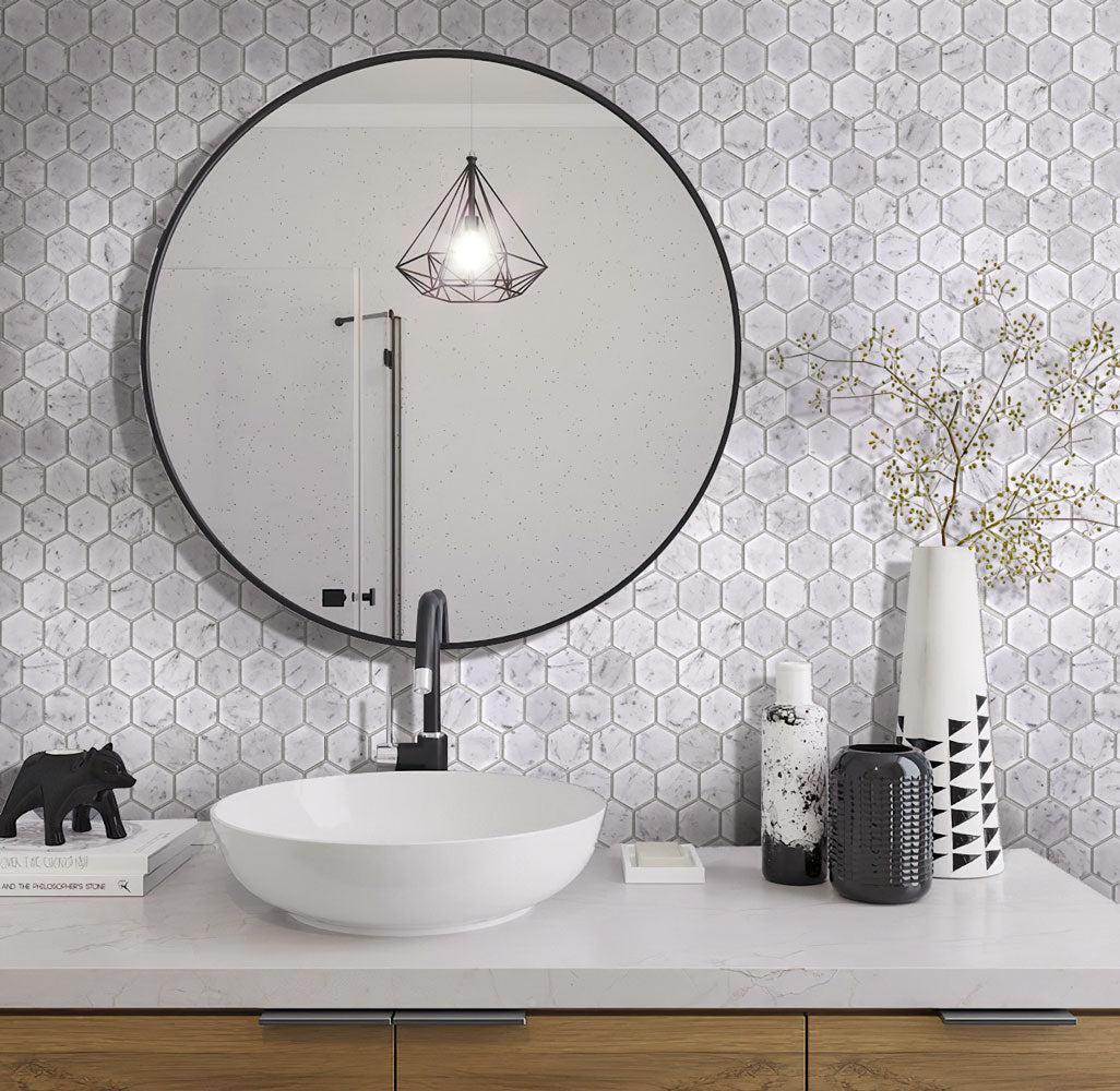 Carrara marble hexagon bathroom wall with contemporary black and white details