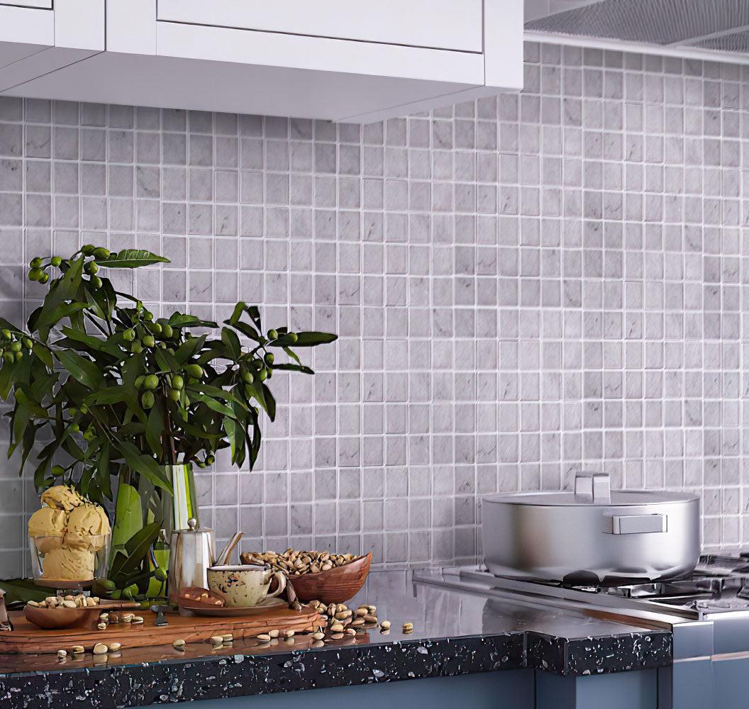 Bright kitchen with square white carrara mosaic tiles on backsplash