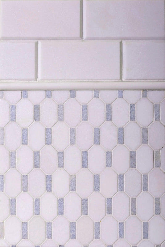 Two types of white marble tile for a backsplash