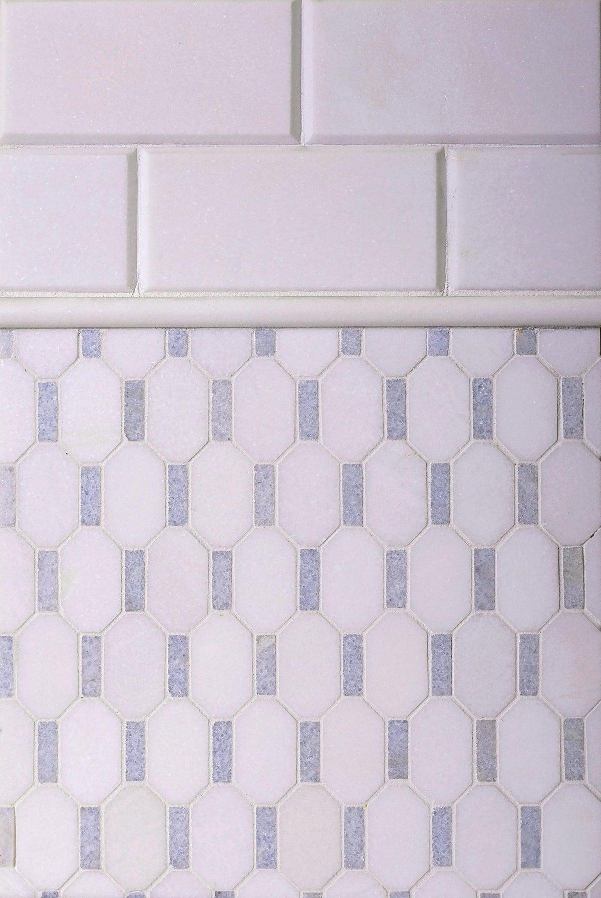 Two types of white marble tile for a backsplash