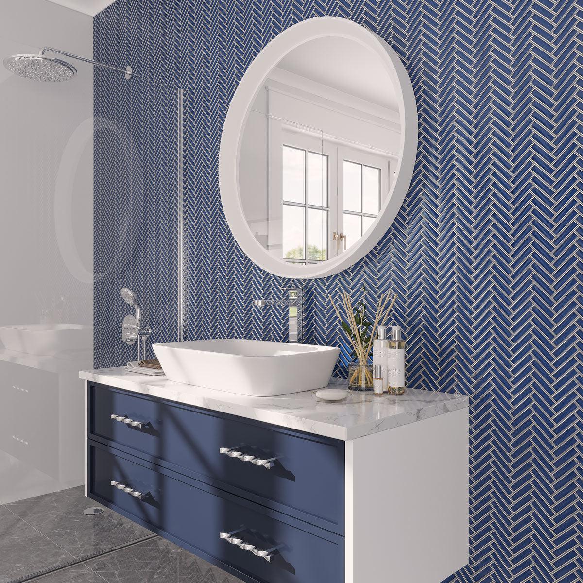 Coastal Glam blue and white bathroom with Art Deco herringbone tile walls