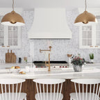 White Marble Kitchen with Calacatta Gold Arabesque Mosaic Tile Backsplash and Copper Lighting Fixtures