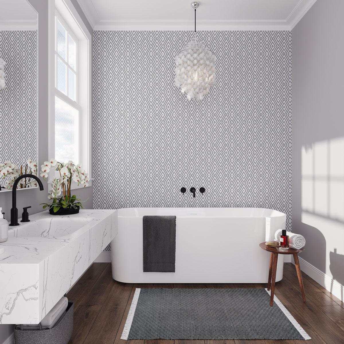 Gray and white bathroom with diamond pattern accent wall tile 