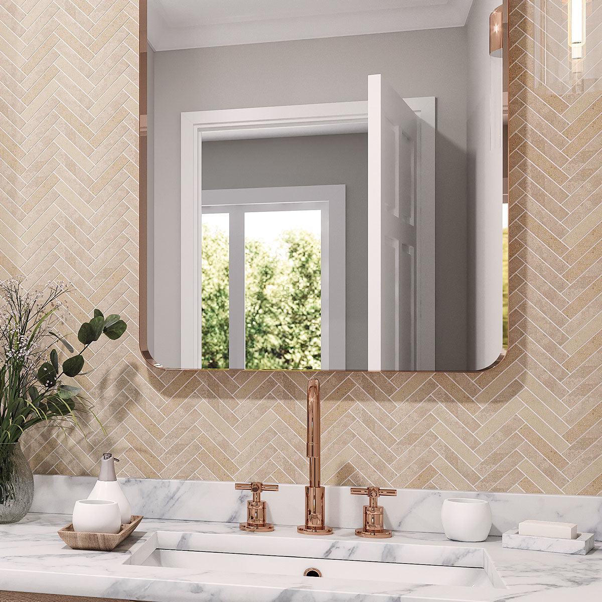 Neutral porcelain herringbone mosaic tile backsplash