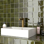 Fresh green tiles for a glazed ceramic bathroom wall