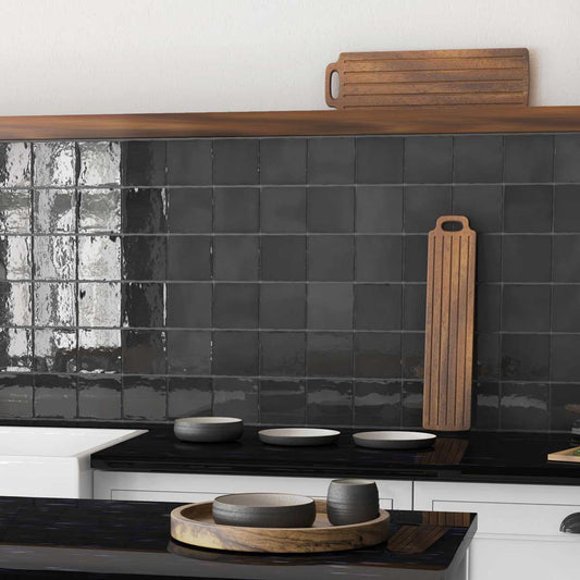 Black and white kitchen with glazed ceramic backsplash tiles in a square design