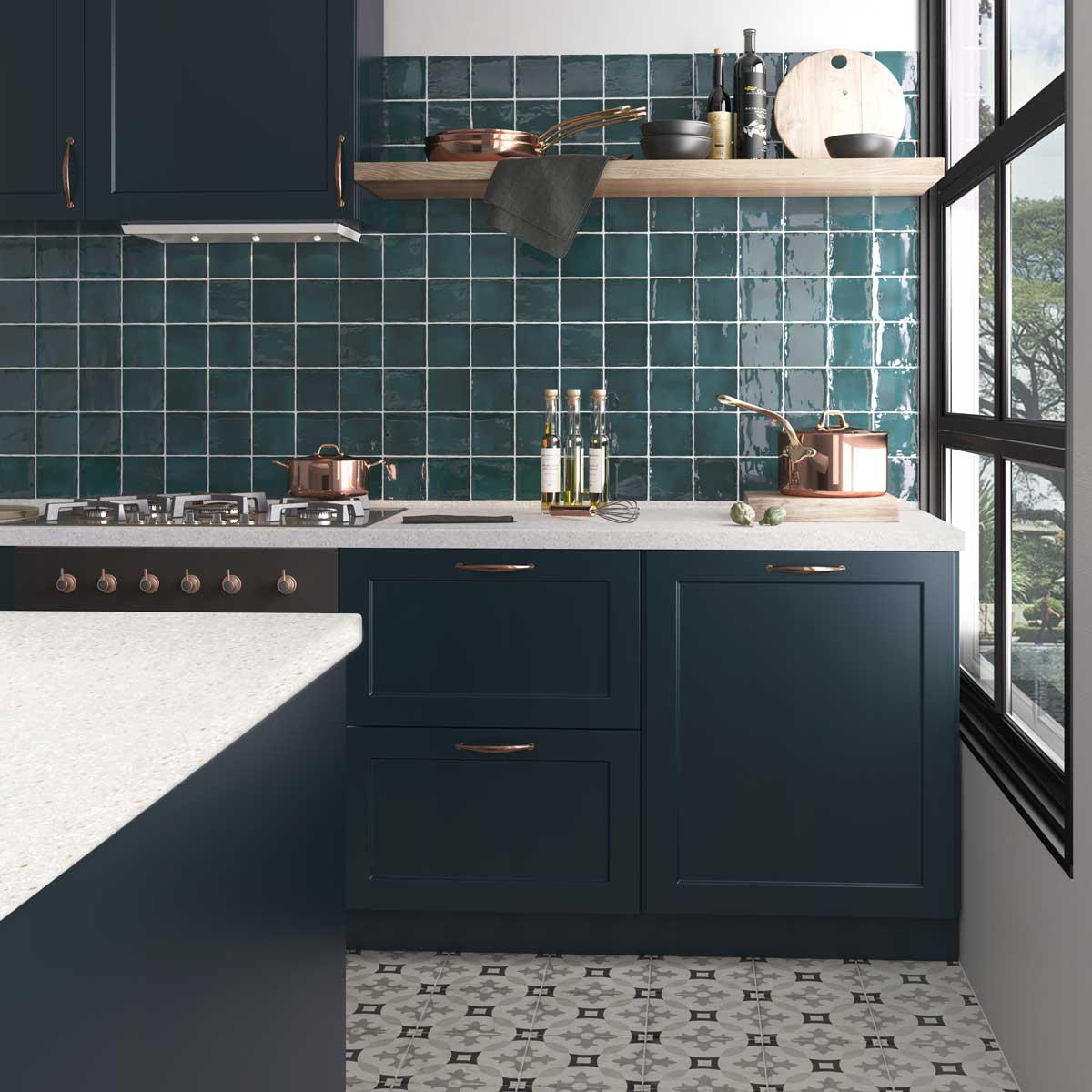 Colorful kitchen backsplash tiles in a vibrant teal color with glossy glaze