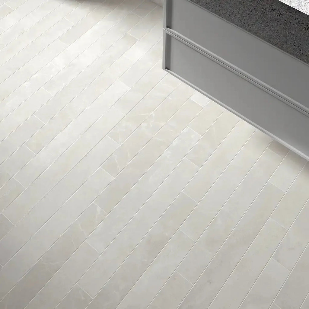 Close-up of a tiled floor with a herringbone pattern