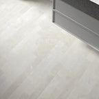 Close-up of a tiled floor with a herringbone pattern