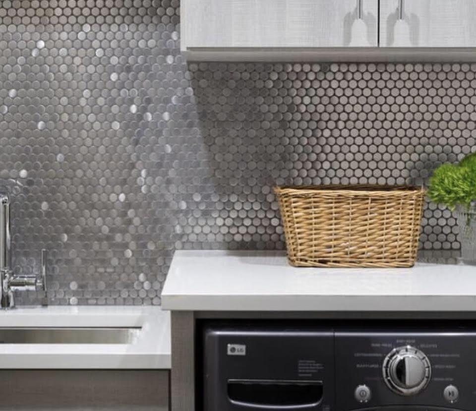 metal penny round tile laundry room backsplash