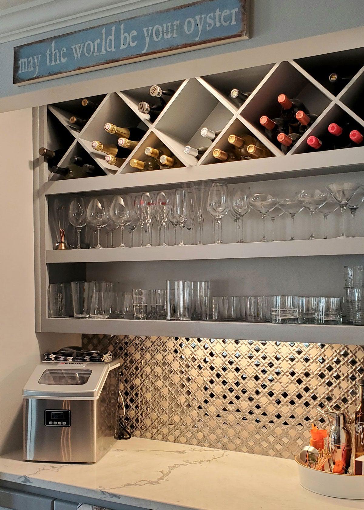 Tile Club Client Install with a Silver Cross And Mirror Squares Mosaic Tile Backsplash for a Wine Bar