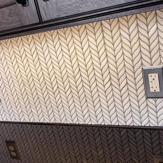 White Leaf Recycled Glass Mosaic Tile installed in a client's kitchen under dark wood stain cabinets