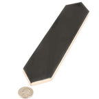 Black ceramic tile with coin