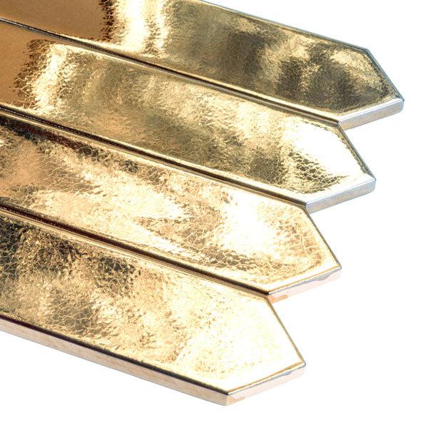 Several gold ceramic tiles close-up