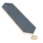 Navy blue ceramic tile with coin