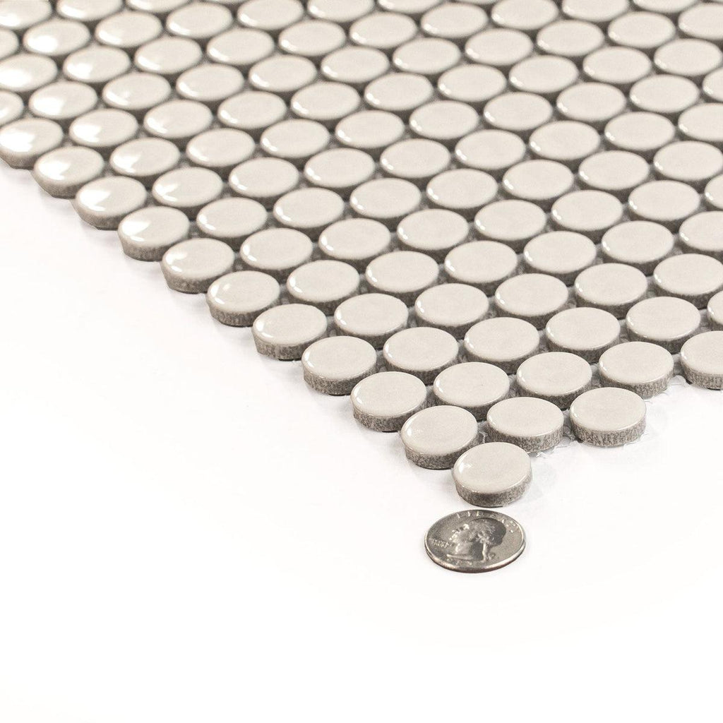 Light beige glossy porcelain penny round tile