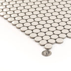 Light beige glossy porcelain penny round tile