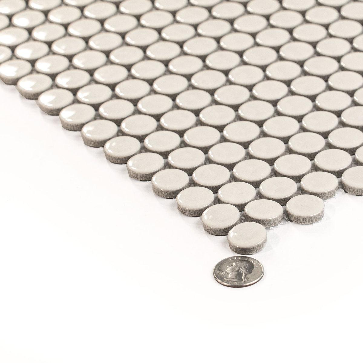 Light beige glossy porcelain penny round tile