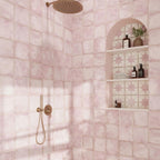Pink shower wall tile and decorative niche