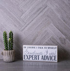 Wood look marble subway tiles in a herringbone layout