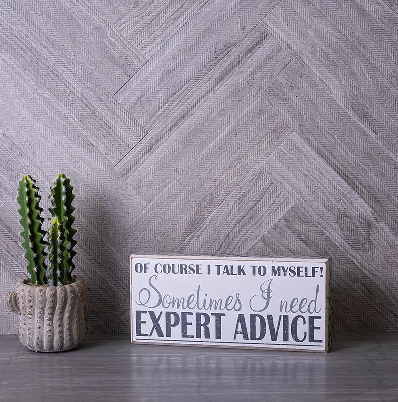 Wood look marble subway tiles in a herringbone layout