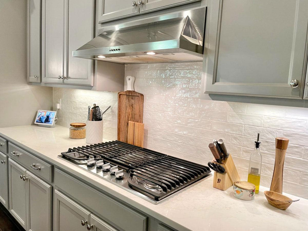 White Handmade Tile Backsplash with Sage Green Cabinet Paint