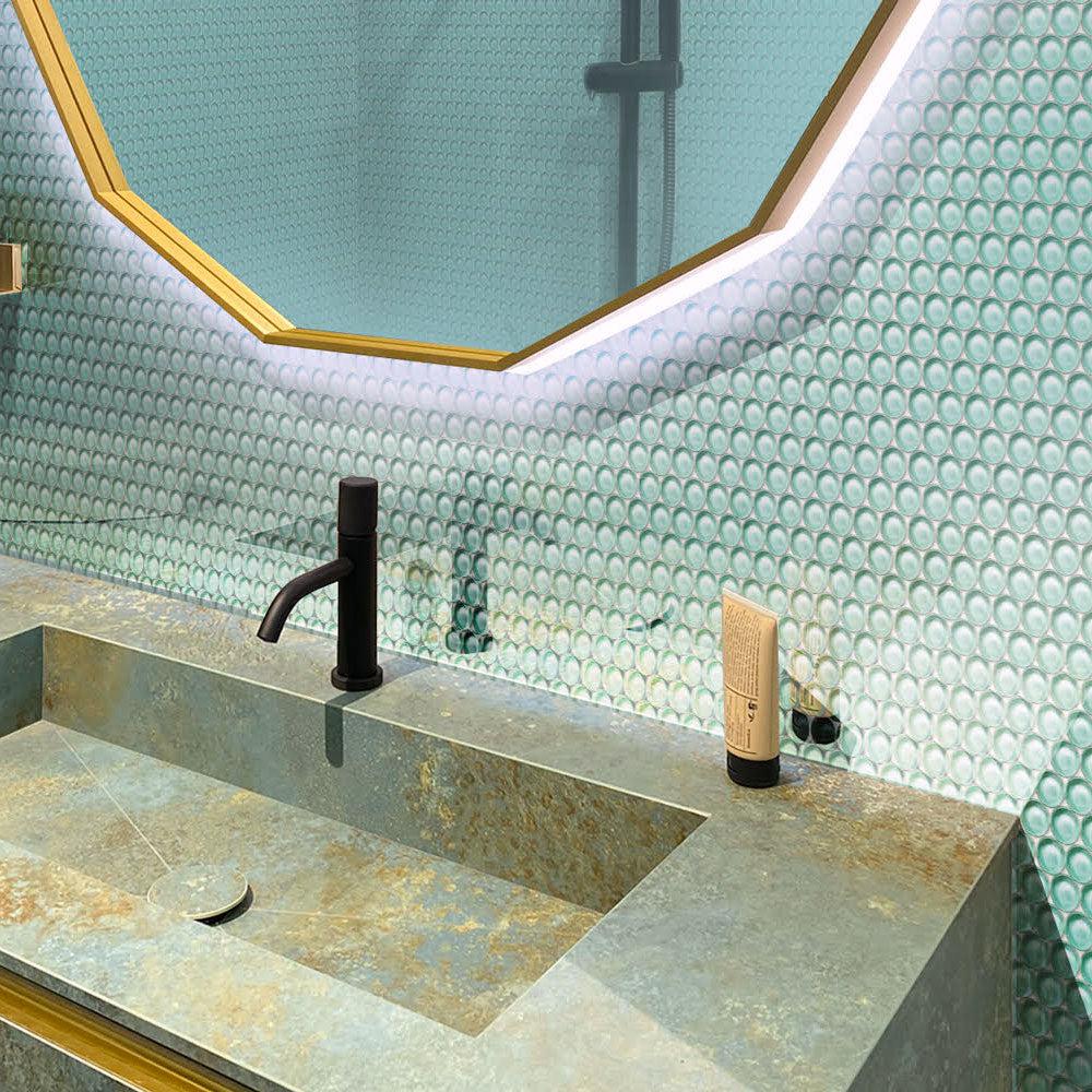 Aqua Glass Penny Round Tile with a patina sink and brass geometric mirror