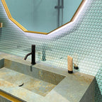 Aqua Glass Penny Round Tile with a patina sink and brass geometric mirror