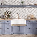 Blue and white kitchen with patterned marble tiles