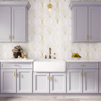 Blue and white kitchen with Art Deco accent wall tile with brass inlay