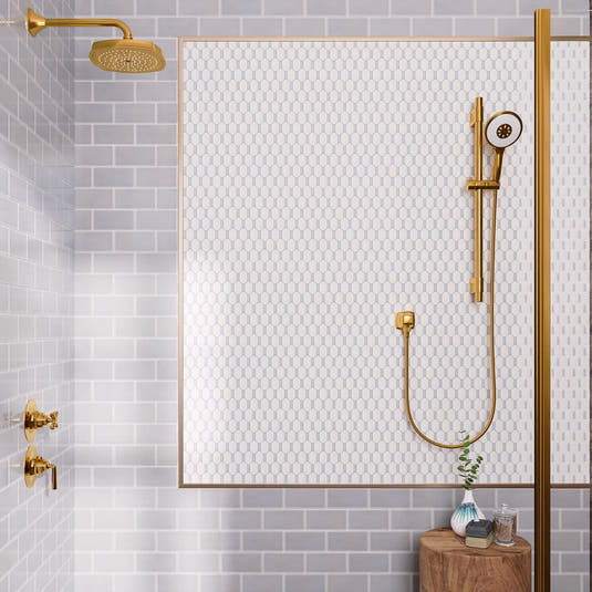 Blue and white shower design with brass rain shower head