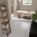 White marble bathroom with Babylon Etched star and cross floor tiles