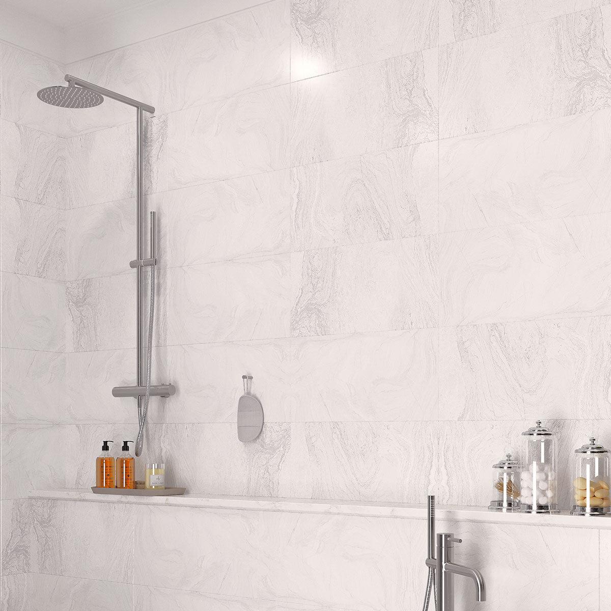 White marble look porcelain tile for a white shower with mnimal grout lines