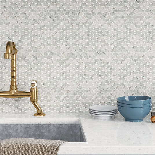 Gray and white oval tile kitchen backsplash