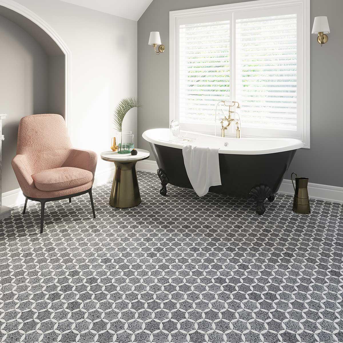 Black and Gray Terrazzo Fleur mosaic bathroom floor with a black claw foot tub