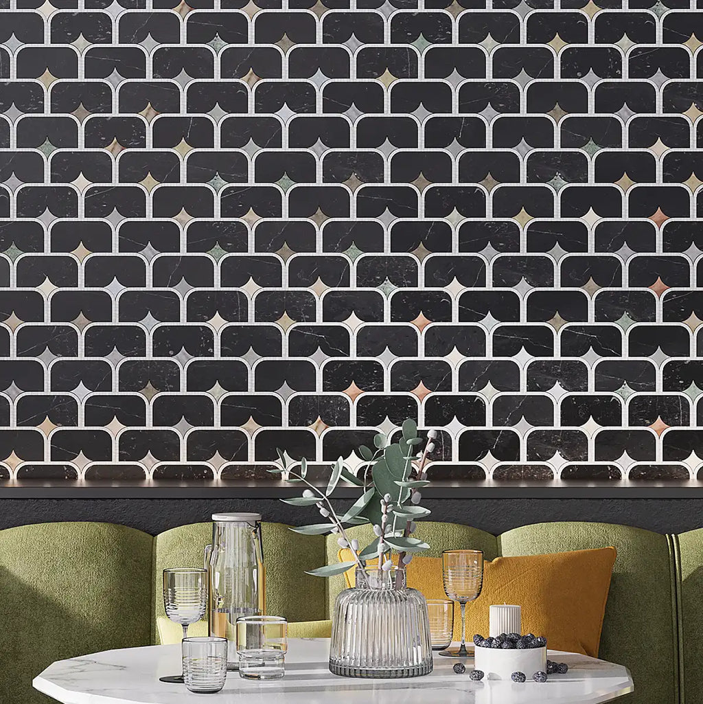 Decorative restaurant accent wall with black marble geometric patterned tile and green sofa