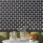Decorative restaurant accent wall with black marble geometric patterned tile and green sofa