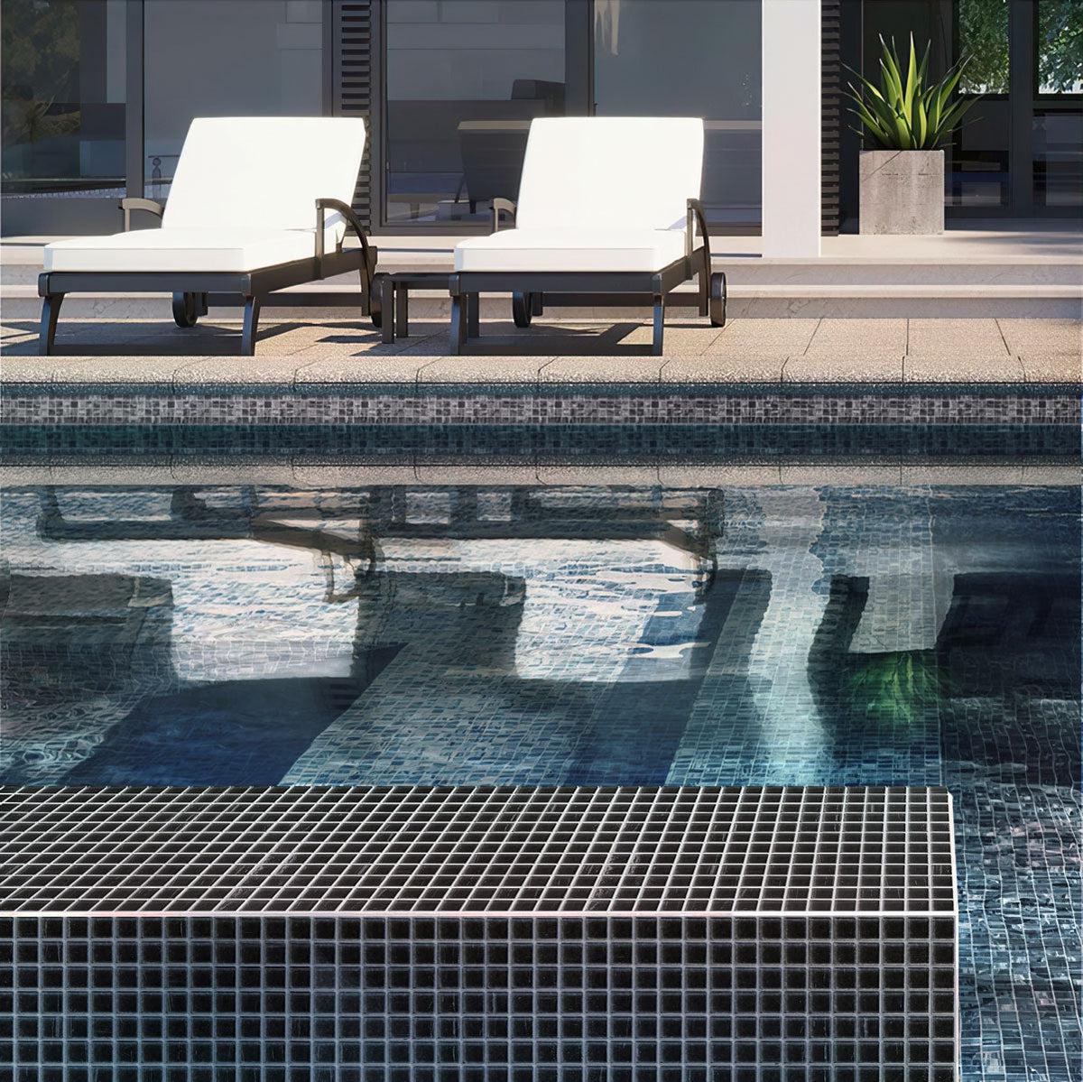 Black brushed glass tile swimming pool facing in sunlight