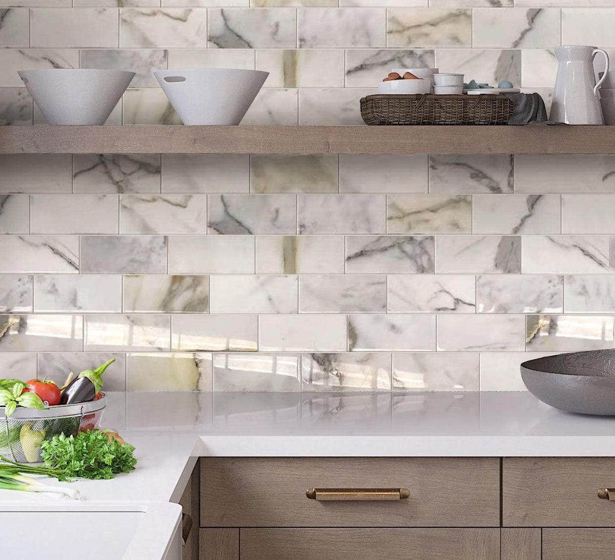 Neutral Kitchen Design with Calacatta marble subway tiles and open shelves